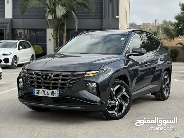 هونداي توسان ترخيص 2022 محرك 1600 هايبرد plug in/يقطع على الشحنه 65 كيلو متر