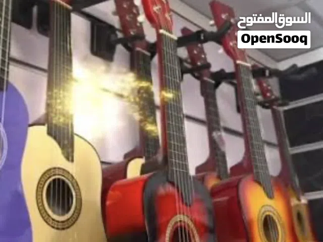جيتار بيبي جديد الطول 65سم مسكر بالكرتونه مع ريشه ووتر ( صغير )
