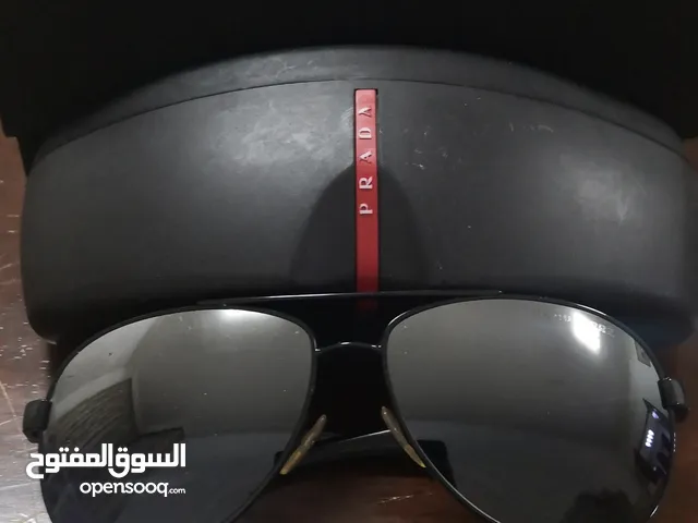 Stylish Prada Sunglasses with sun glare resistant lenses comes with original box.