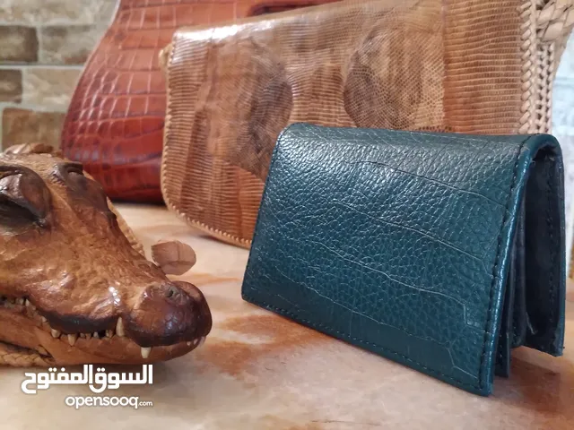 شنط نسائية من جلد التمساح و الثعبان