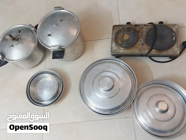 طناجر سيب وطناجر مقلوبة وغاز كهربائي