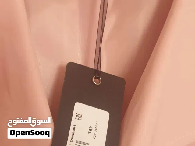 ترانس كوت جديد بنمرته نمره 44 غير مستعمل ابدا ولون المشمشي الهادي