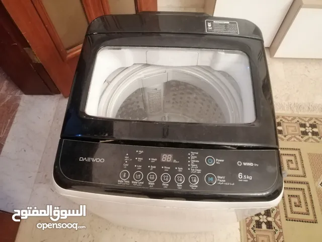 غساله توماتيك نوعها داوو أصلية 6/5كيلو تخدم أمورها تمام عيبها مزدوري فقط