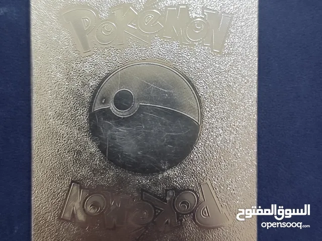 Pokémon card silver with 320 hp and 10 football cards