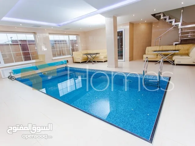 شقة مع حديقة ومسبح خاص للبيع في رجم عميش بمساحة بناء 270م