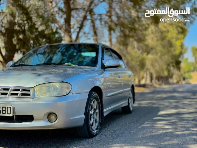 كيا اسبكترا اتوماتيك موديل 2002 فحص ممتاز كراسي مدفيه الفحص مرفق السعر قابل للتفاوض بشيء بسيط