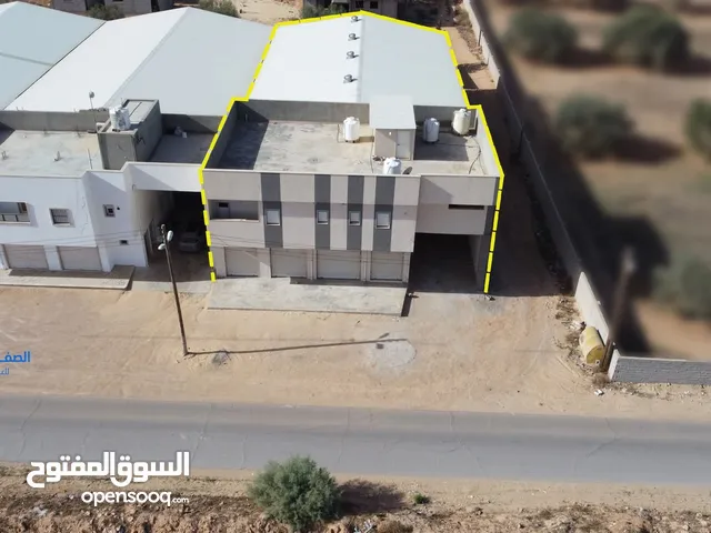 عقار مبنى تجاري سكني-مخزن للبيع طمينة- تفرع طريق طمينة الرئيسي - أرض 860م2 - مسقوف الهنقر 600 م2