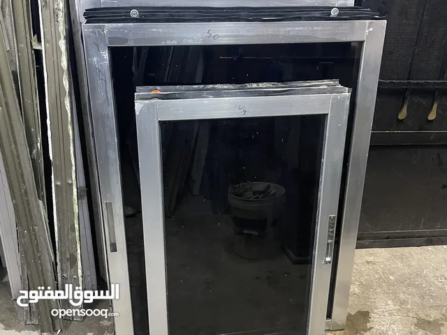 شبابيك الامنيوم لون سلفر زجاج برونز