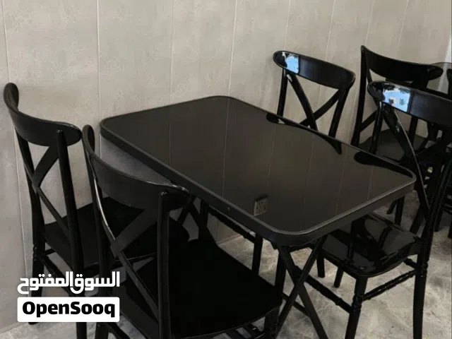 ميز قابل للطي  السطح زجاج مع 4 كراسي عظم عاج