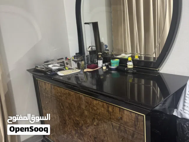 A dressing table set with a 2 side tables