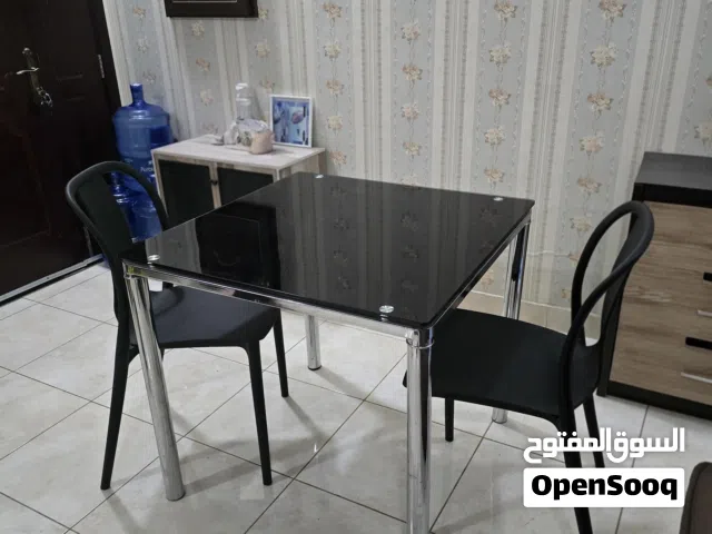 Stainless steel dinning table with tempered glass with 2 chairs for sale