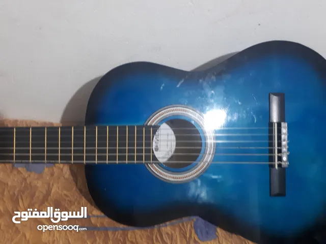 Guitar classic llbi3 m3ah sac w neuf na9so watar