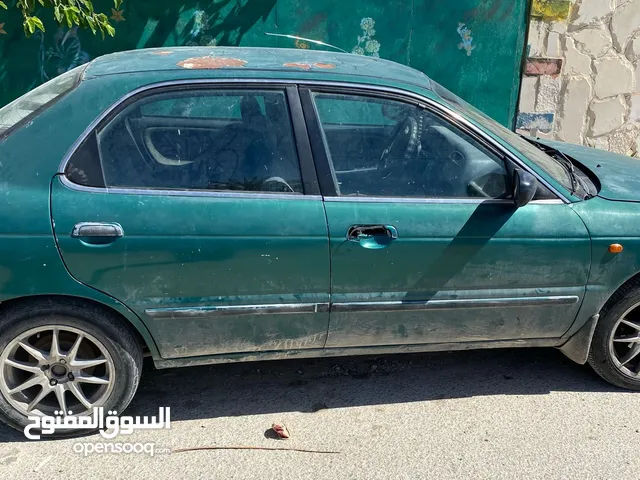 سوزوكي بالينو موديل 2000 بحاجة دهان وترخيص جير عادي ماتور 1500 قطارة بنزين