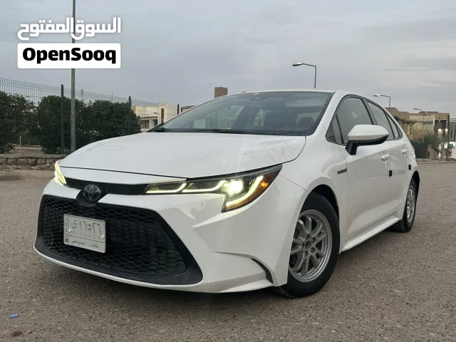 تيوتا كورولا 2021 وارد امريكي هايبرد Le ابيض السياره نضيفه ومابيها اي نواقص مرقم بغداد بيع مباشر