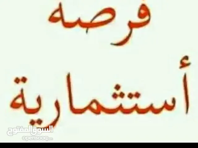 مبنى تجاري وفيلا في حي الدولار