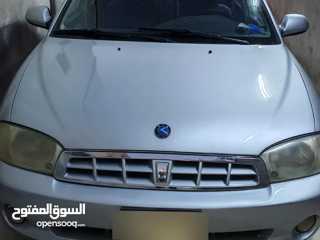 كيا سبكترا 2001 دهان جديد قير جديد مع كفالته صيانة كاملة ولا طقة