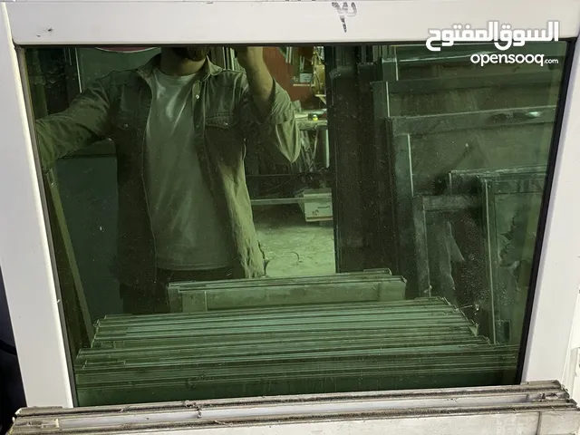 شبابيك الامنيوم لون ابيض زجاج اخضر