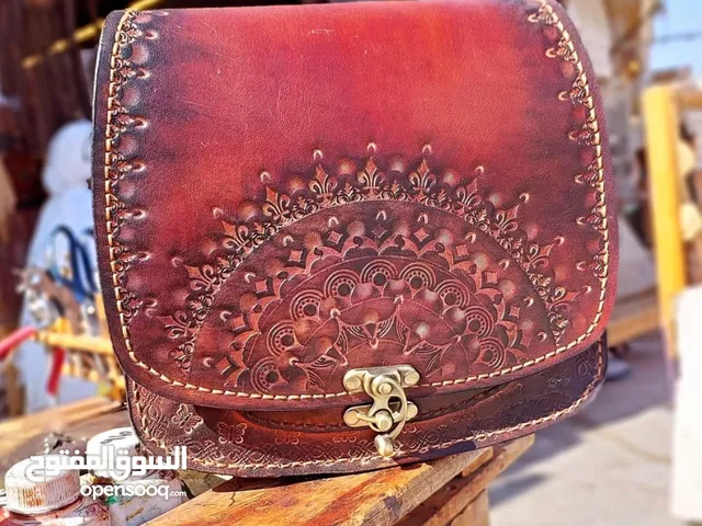 Handmade bag made of natural leather with natural stone
