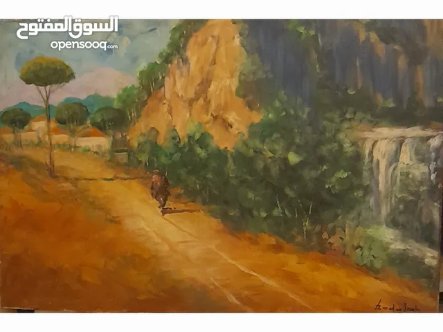 منظر لبناني طريق رملية وجبل بجانبه شلال وبيوت قرميد فلاح راكب الدابة