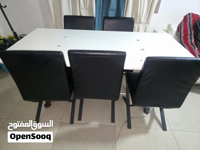 White Rectangular table with 6 black sofa chair
