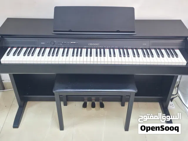 The Casio Celviano AP-250 is an 88-key console-style digital piano featuring a Tri-sensor Scaled