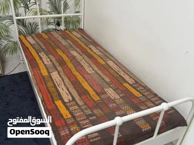 two White steel frame bed
