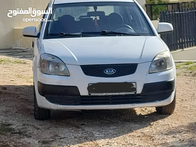كيا برايد لون ابيض 2008
