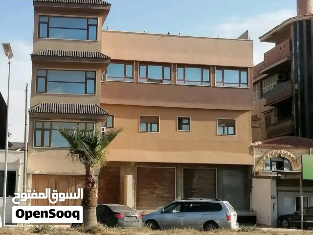 مبنى تجاري ع الرئيسي ف تاجوراء طريق الشط بالقرب من منارة تاجوراء ومصحة الاخوه