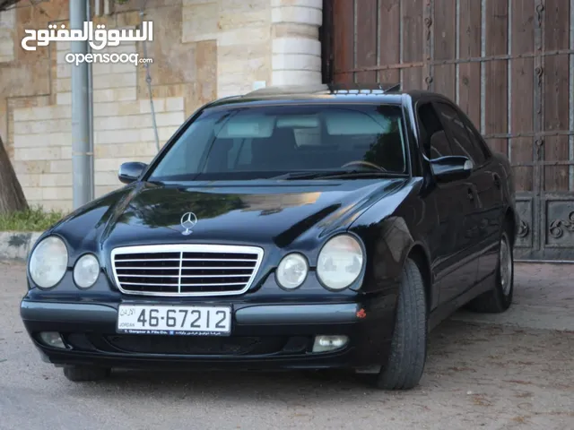 E200. 2002 قرش ونص 2002 رقم الهاتف بالوصف