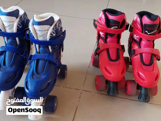 Adjustable 4-Wheel Roller Skates – Two Pairs (Blue & Red) each pair : 7 OMR