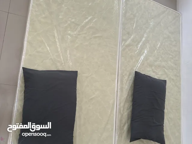 Two mattresses with two pillows