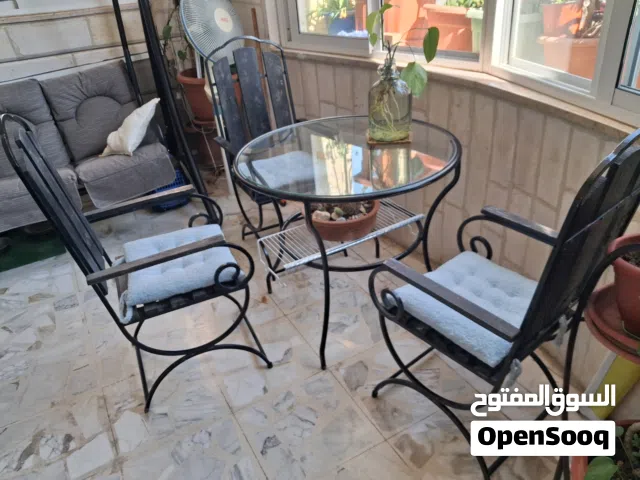 طاوله حديد ووجه زجاج