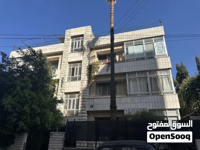 عمارة في جبل الحسين اربع واجهات حجر ثلاث طوابق مؤجرة كامل