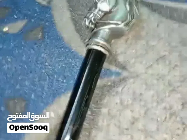 سيف مع غمده + عصى