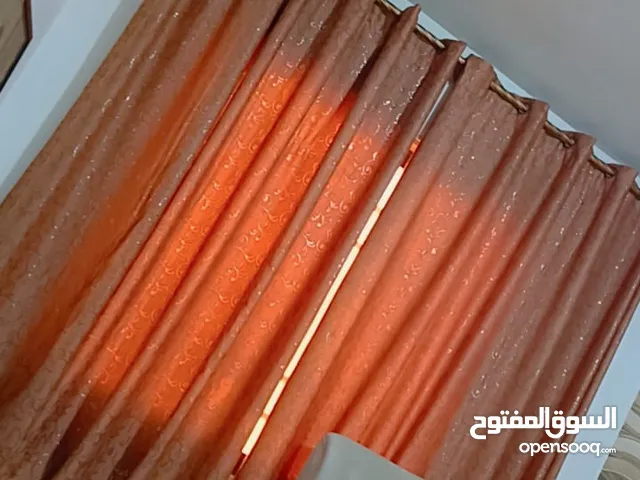 برداية مكونة من قطعتين لون بني شبه جديدة