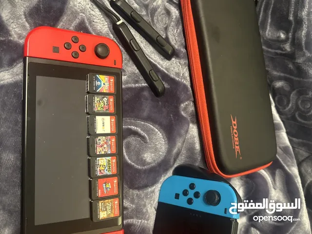 Nintendo switch (4 Joy cons, 7 Games included, and case to carry games, device and joycon straps)
