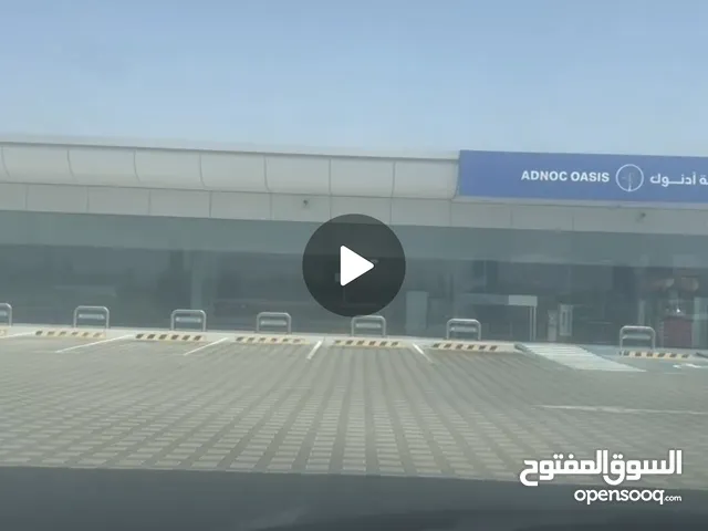 Cafeteria inside Adnoc petrol station including cooking equipment and refrigerators