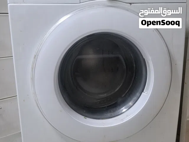 غسالة سامسونج 7 كجم تحميل أمامي، برامج متعددة، عصر 1200 دورة، تعمل بشكل جيد، تحتاج تبديل زجاج/جام