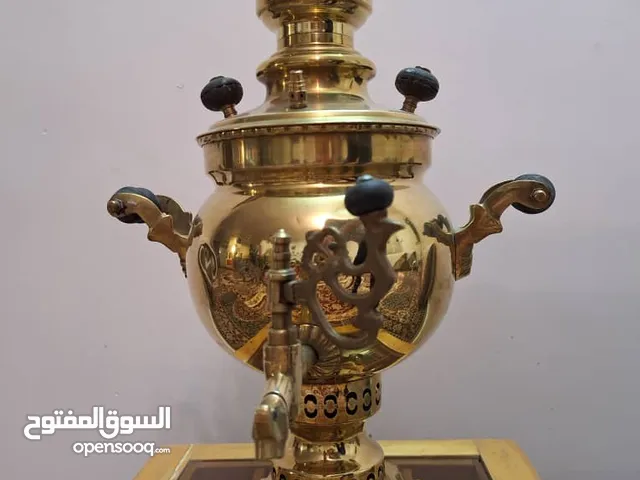 An antique, exquisite 37 cm bronze samovar featuring a traditional charcoal-burning design.