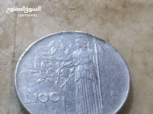 قطعة نقدية إيطالية من فئة 100 ليرة، وتُظهر تاريخ 1957.