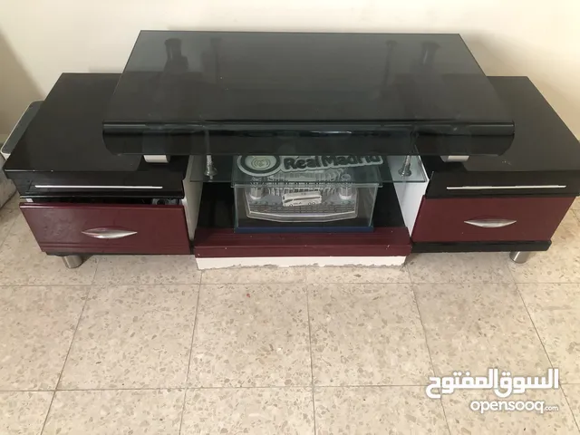 طاولة تلفزيون خشب وزجاج
