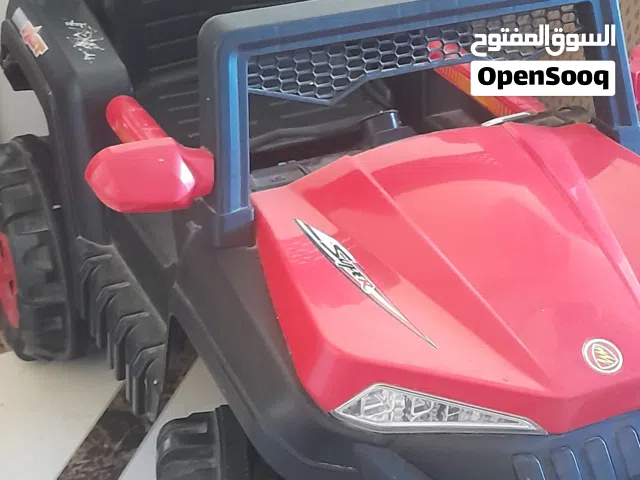 سيارة اطفال حمراء مستعملة للبيع