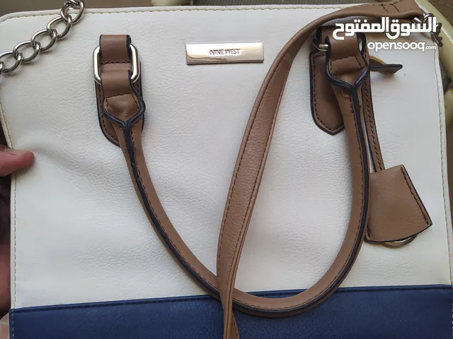 Sale used genuine leather handbags ladies, brand nine west,price 20 BD.