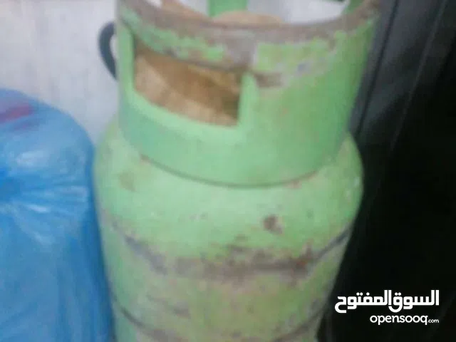 جرة غاز فيها قريب النص