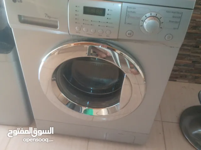 غساله الجي 7كيلو لون سيلفر توفير مي وكهرباء بحالة الوكالهه مع كلر شبه جددديد لون سلفرر