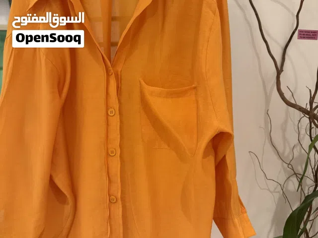 قميص برتقالي نسائي راقي جديد غير مستعمل