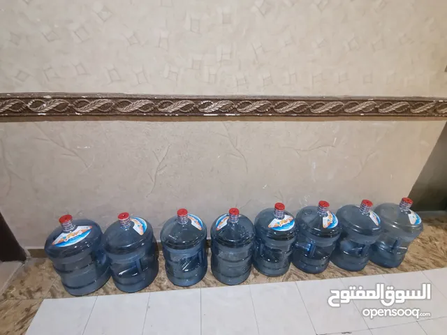 9 علب ماء المنهل فارغه