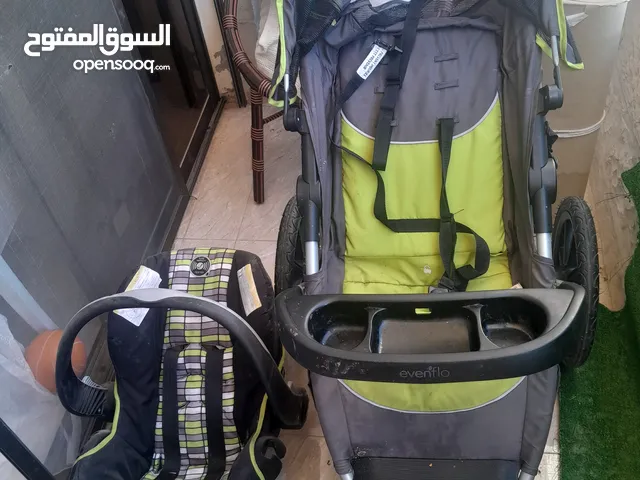 عرباية اطفال امريكي evenflo مع كرسي سيارة evenflo للبيع