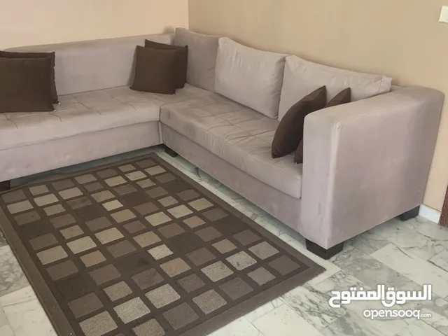 L shaped sofa and carpet
