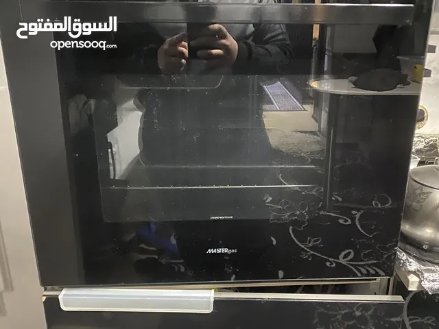فرن كهربائي و غازي بلتن اللون اسود للبيع